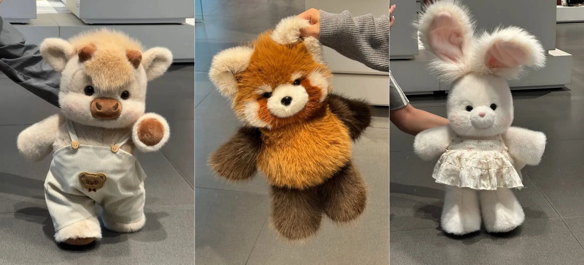 Three plush animal toys shown side by side: a cream-colored bear wearing white overalls, an orange and brown red panda, and a white bunny in a white dress. Human hands are visible holding or touching the toys, and the background is an indoor floor and wall.